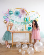 Pastel mermaid birthday decorations with balloons and kids from Parte Haus party supply store in Bethesda Maryland