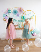 Pastel birthday backdrop with teal and pink decorations balloons and party table from Parte Haus party supply store in Bethesda MD