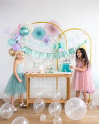 Pastel mermaid birthday decorations with balloons and two girls from Parte Haus party supply store in Bethesda MD