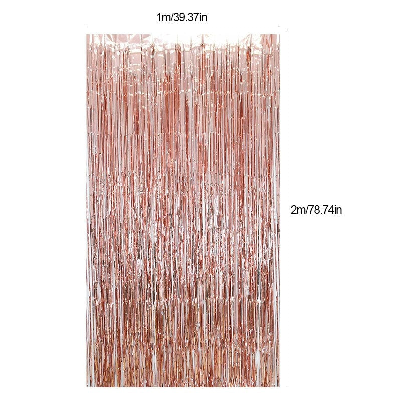 Rose gold foil fringe curtain backdrop for birthday celebration from Parte Haus party supply store in Bethesda MD