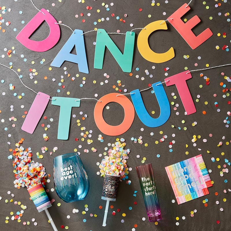 Rainbow dance banner confetti and colorful cups birthday celebration from Parte Haus party supply store in Bethesda MD