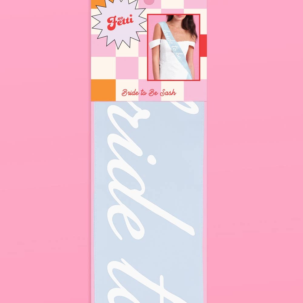 Light blue bride to be sash with white script for bachelorette from Parte Haus party supply store in Bethesda MD