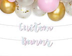 Pink white and gold balloon garland with custom pastel banner birthday from Parte Haus party supply store in Bethesda MD