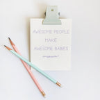 White letterpress new baby congrats card with purple text and pastel pencils from Parte Haus party supply store in Bethesda Maryland