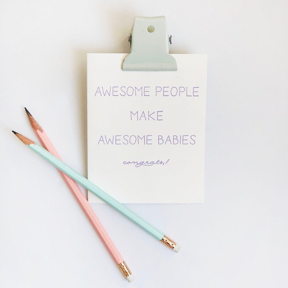 White letterpress new baby congrats card with purple text and pastel pencils from Parte Haus party supply store in Bethesda Maryland