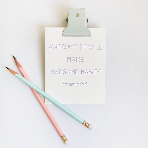 White letterpress new baby congrats card with purple text and pastel pencils from Parte Haus party supply store in Bethesda Maryland