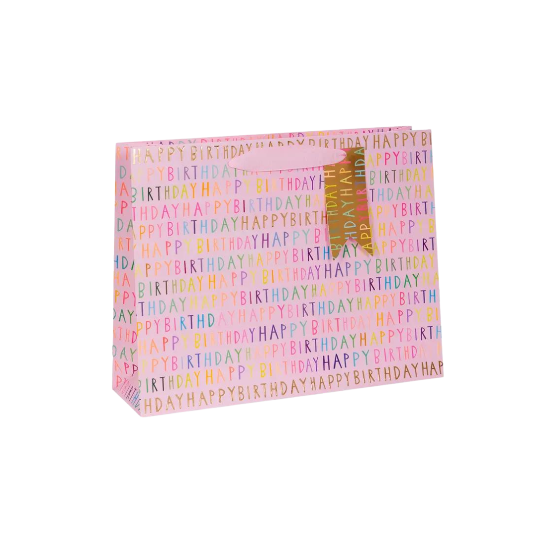 Pink birthday gift bag with colorful happy birthday text large size from Parte Haus party supply store in Bethesda Maryland