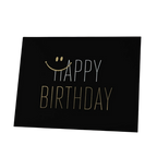 Black and gold birthday card with smiley face design for birthday from Parte Haus party supply store in Bethesda MD.
