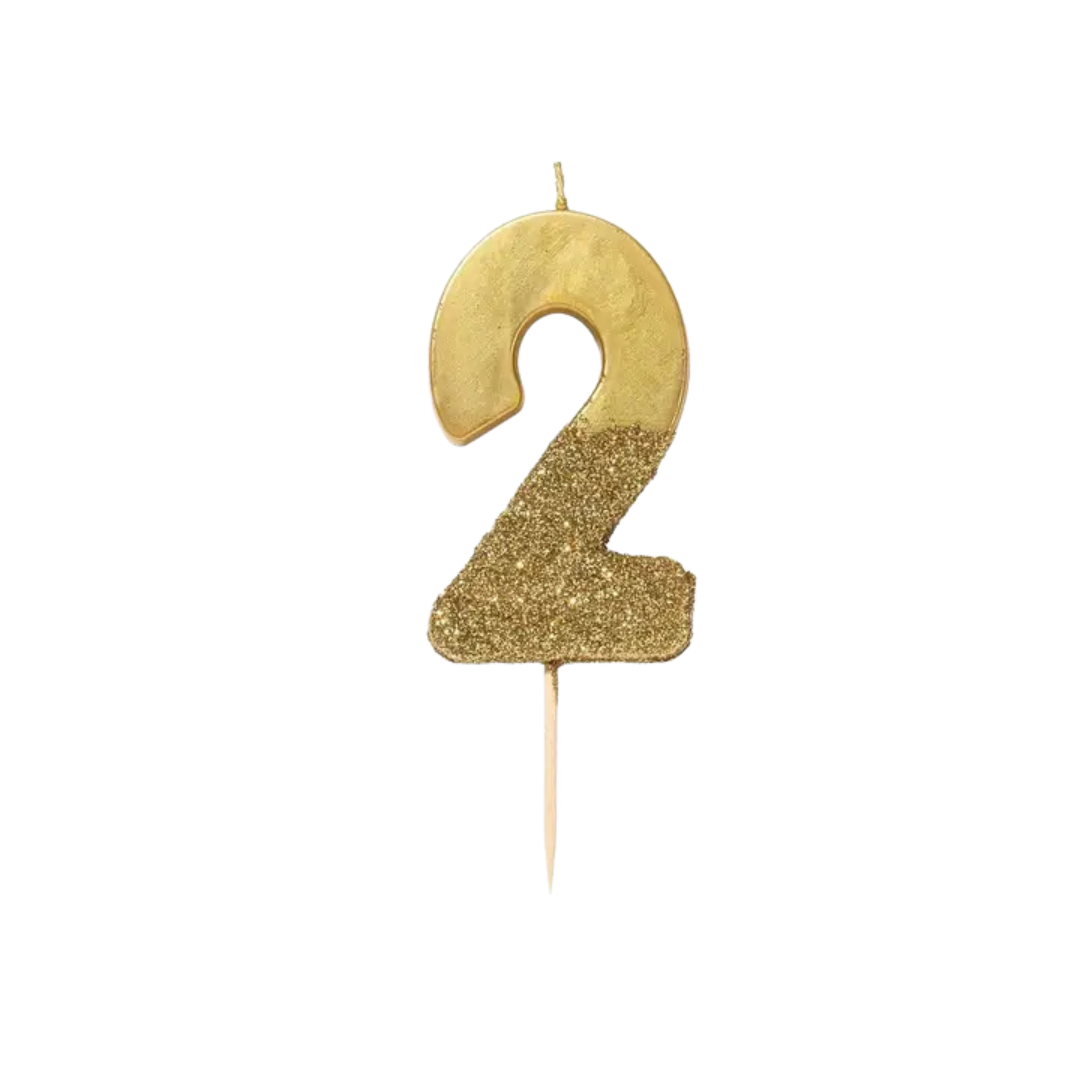 Gold number two glitter birthday candle for celebration from Parte Haus party supply store in Bethesda Maryland