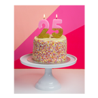 Pink and gold birthday candles on a sprinkle cake birthday decoration from Parte Haus party supply store in Bethesda Maryland