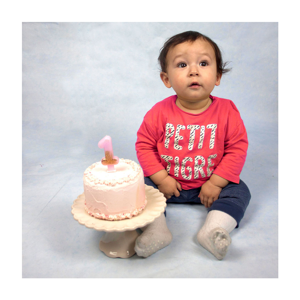 Pink birthday candle starter kit with number one candle and cake for first birthday from Parte Haus party supply store in Bethesda Maryland