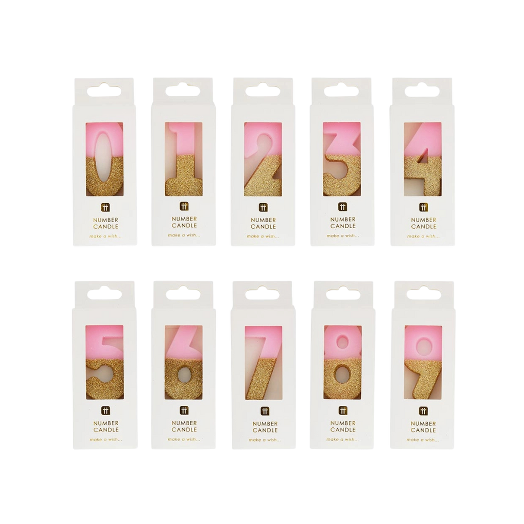 Gold glitter number birthday candles in pink packaging from Parte Haus party supply store in Bethesda Maryland