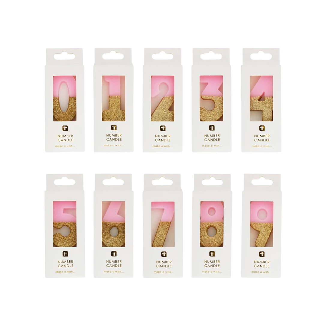 Gold glitter number birthday candles in pink packaging from Parte Haus party supply store in Bethesda Maryland
