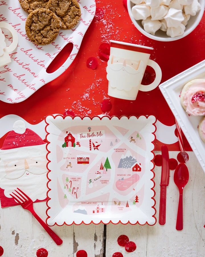 Red and white North Pole Christmas plate and Santa napkin for holiday theme from Parte Haus party supply store in Bethesda MD