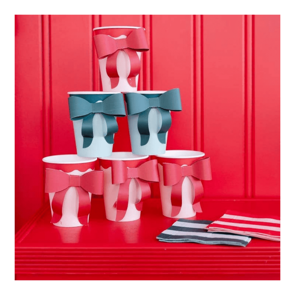 Red and blue bow paper cups with matching striped napkins for patriotic or birthday theme from Parte Haus party supply store in Bethesda MD.