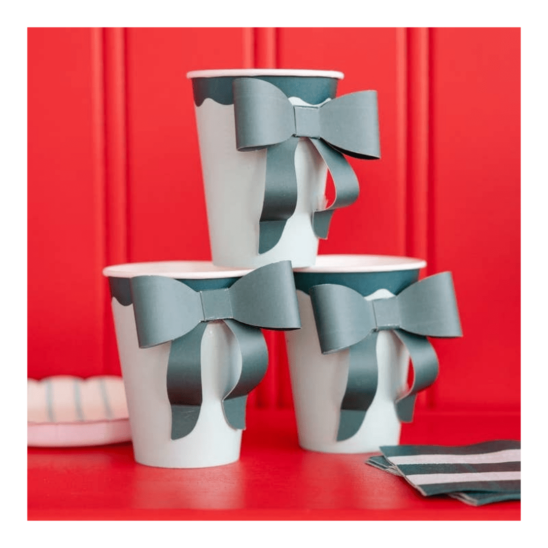 Blue and white bow paper cups with 3D bow design for birthday from Parte Haus party supply store in Bethesda Maryland