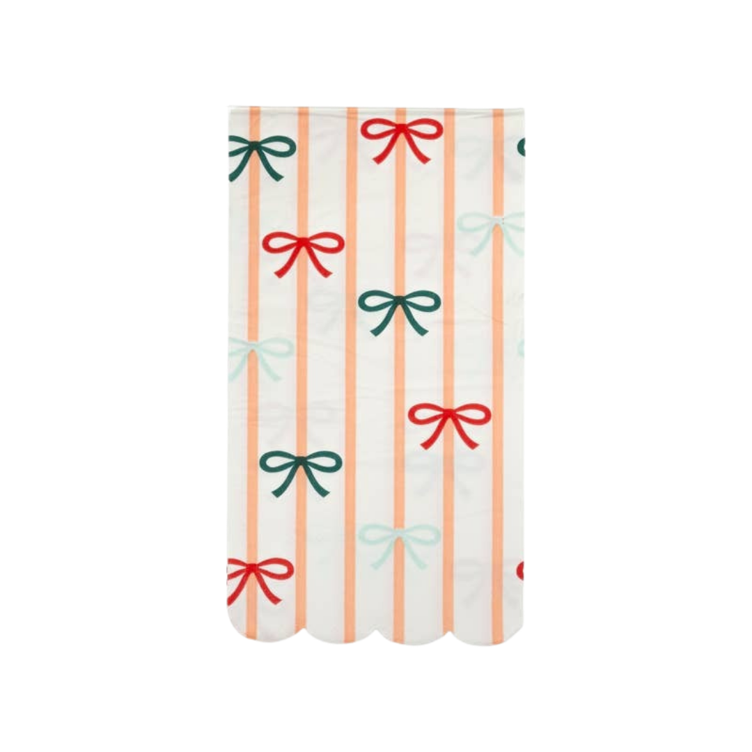 Peach striped and multicolor bow paper table cover for celebrations from Parte Haus party supply store in Bethesda MD