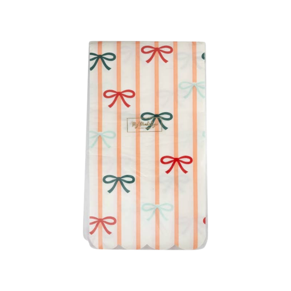 Peach striped and bow plastic table cover with pastel bow accents birthday theme from Parte Haus party supply store in Bethesda MD