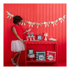 Red and white holiday table decor with bows and festive treats Christmas theme from Parte Haus party supply store in Bethesda MD