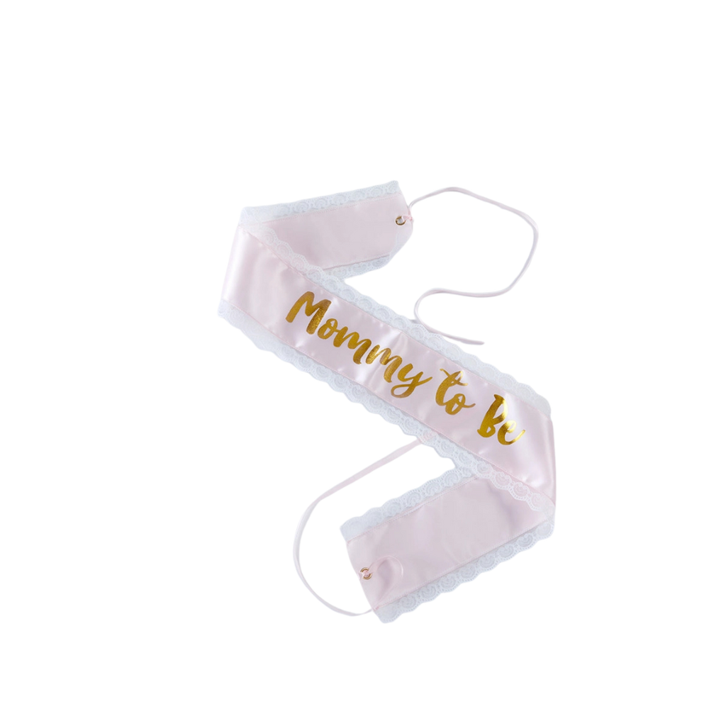 Pink mommy to be sash with gold letters baby shower from Parte Haus party supply store in Bethesda MD