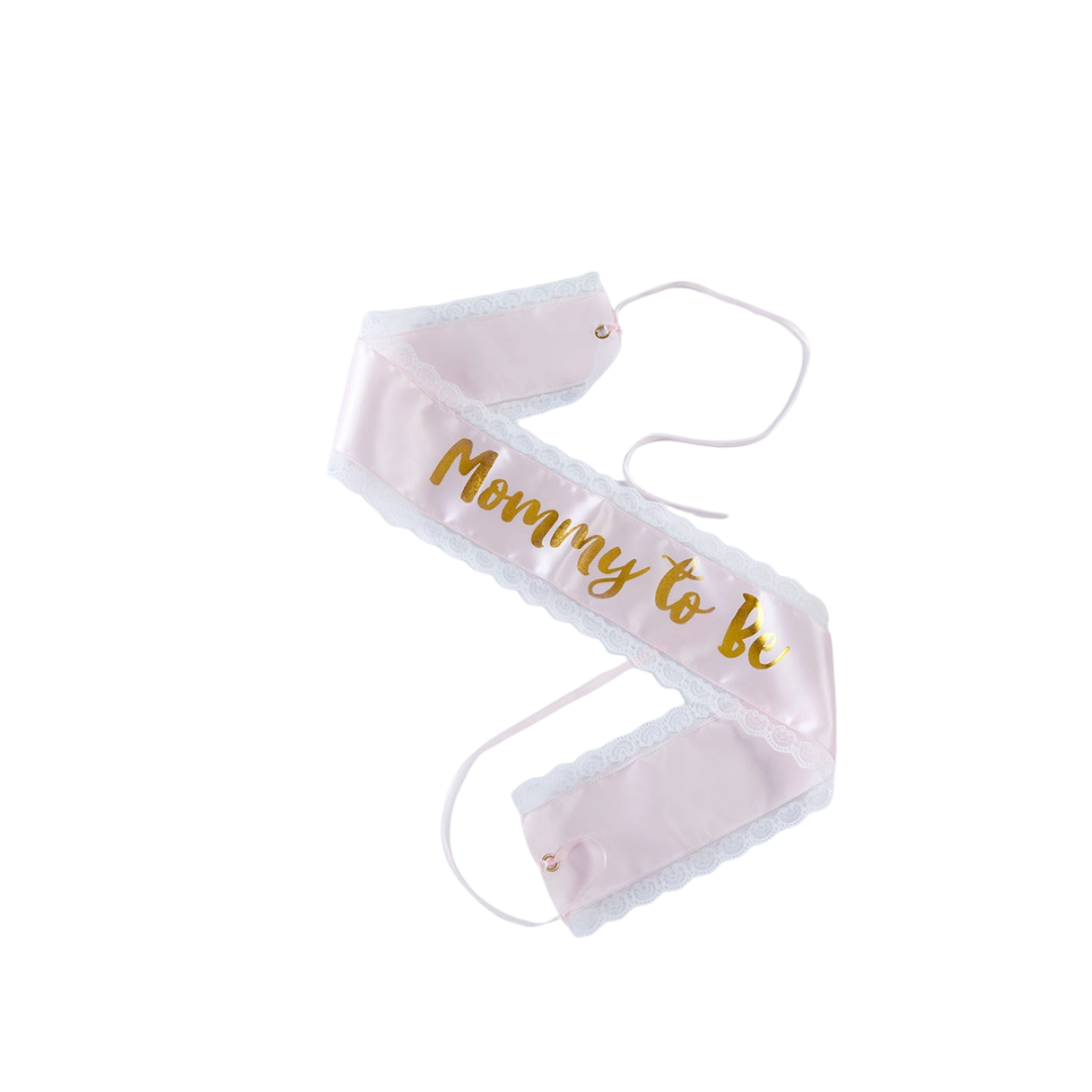 Pink mommy to be sash with gold letters baby shower from Parte Haus party supply store in Bethesda MD