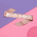 Rose gold Bride to Be sash with diamond icon for bachelorette theme from Parte Haus party supply store in Bethesda Maryland