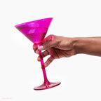 Pink Barbie martini glass held in hand for birthday or celebration from Parte Haus party supply store in Bethesda Maryland