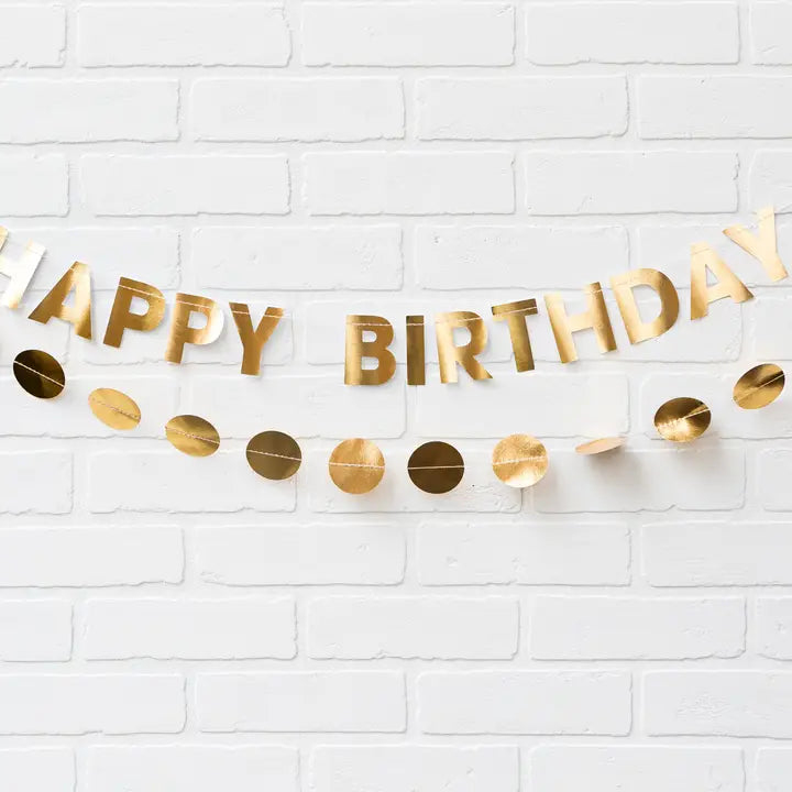 Gold happy birthday banner with metallic circle garland for birthday theme from Parte Haus party supply store in Bethesda Maryland