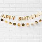 Gold happy birthday banner with metallic circle garland for birthday theme from Parte Haus party supply store in Bethesda Maryland