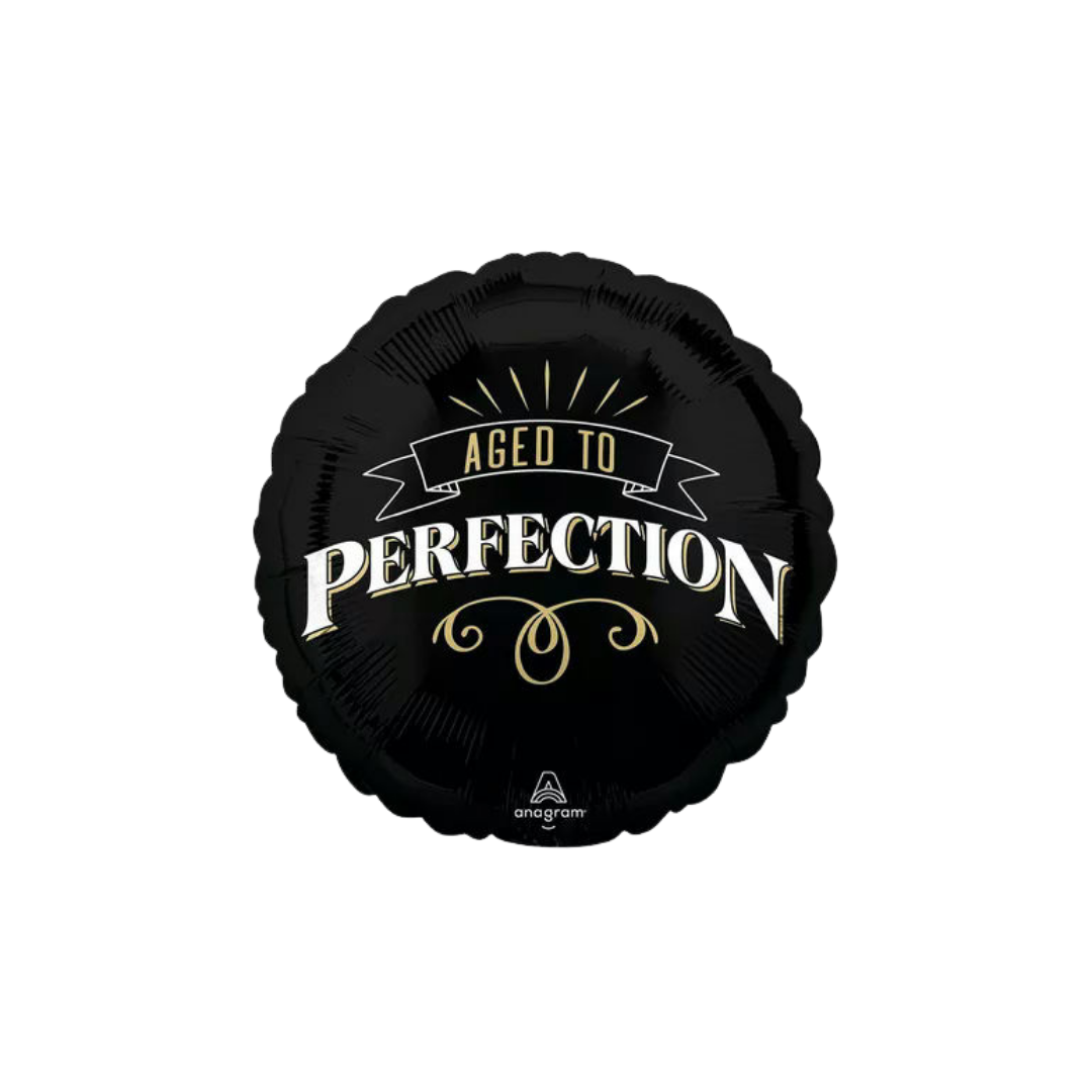 Black birthday foil balloon with aged to perfection text birthday theme from Parte Haus party supply store in Bethesda Maryland