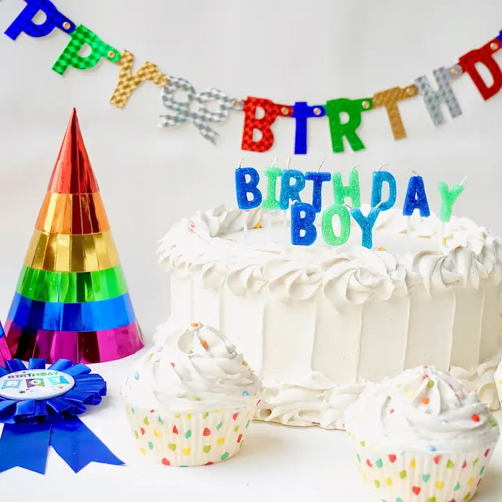 blue and green birthday boy candle set on cake birthday theme from Parte Haus party supply store in Bethesda Maryland