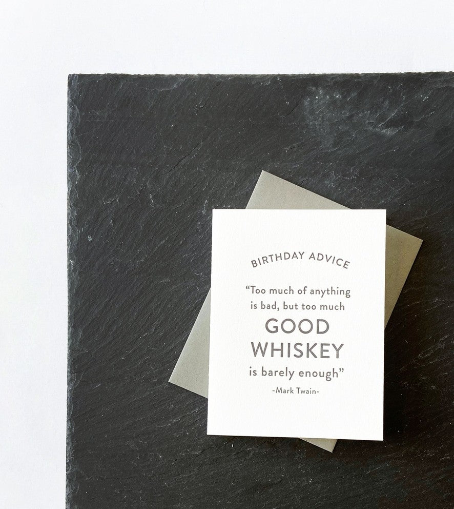 White birthday greeting card with whiskey quote on black slate birthday theme from Parte Haus party supply store in Bethesda Maryland