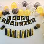 Black gold birthday decoration kit with balloons and banner for birthday from Parte Haus party supply store in Bethesda Maryland