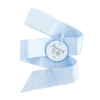 Blue sash ribbon with white polka dots Mummy To Be badge for baby shower from Parte Haus party supply store in Bethesda Maryland