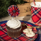 Blue and red plaid holiday cups and plates with a cupcake from Parte Haus party supply store in Bethesda Maryland