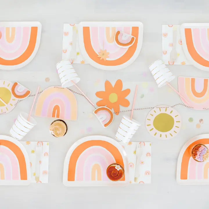 Peach and pink rainbow plates with napkins and cups boho birthday from Parte Haus party supply store in Bethesda MD