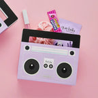 Purple boombox gift bag filled with treats 80s birthday party favor from Parte Haus party supply store in Bethesda MD