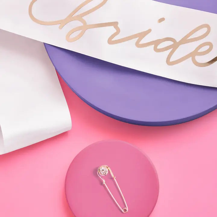 Rose gold bride sash with metallic text and pin for bachelorette from Parte Haus party supply store in Bethesda MD