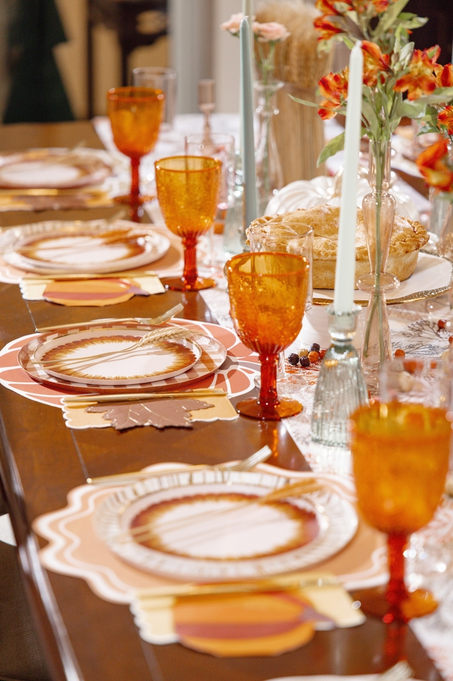 Brown and orange autumn leaf shaped cocktail napkins on a fall table from Parte Haus party supply store in Bethesda Maryland