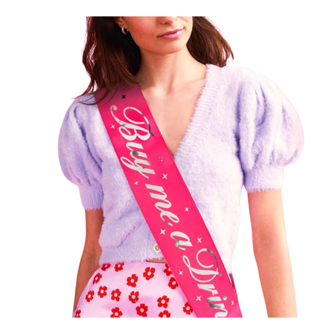 Pink Buy Me a Drink sash with silver stars for bachelorette from Parte Haus party supply store in Bethesda Maryland