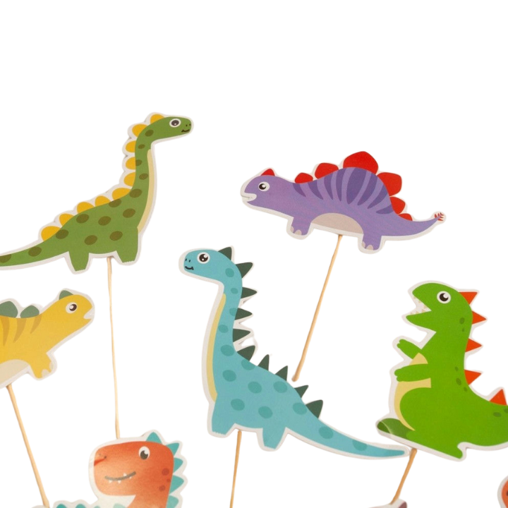 Colorful dinosaur cake toppers cartoon Jurassic birthday from Parte Haus party supply store in Bethesda MD.