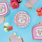 Pink striped dinner plates with floral cookies for spring or bridal celebration from Parte Haus party supply store in Bethesda MD