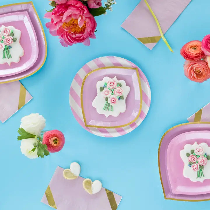 Pink striped dinner plates with floral cookies for spring or bridal celebration from Parte Haus party supply store in Bethesda MD