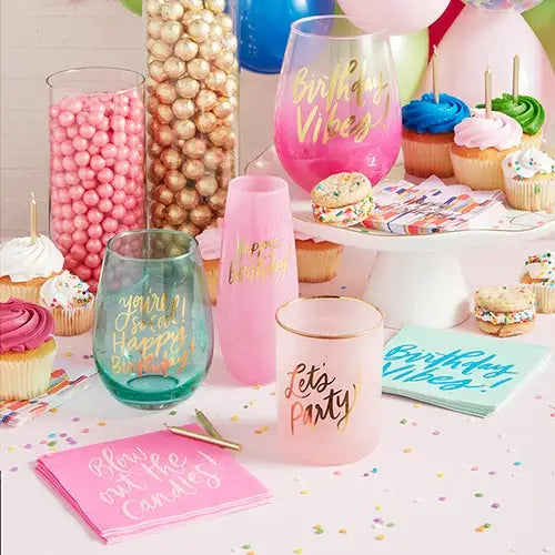Pink and teal champagne glass birthday theme table setting with cupcakes from Parte Haus party supply store in Bethesda MD