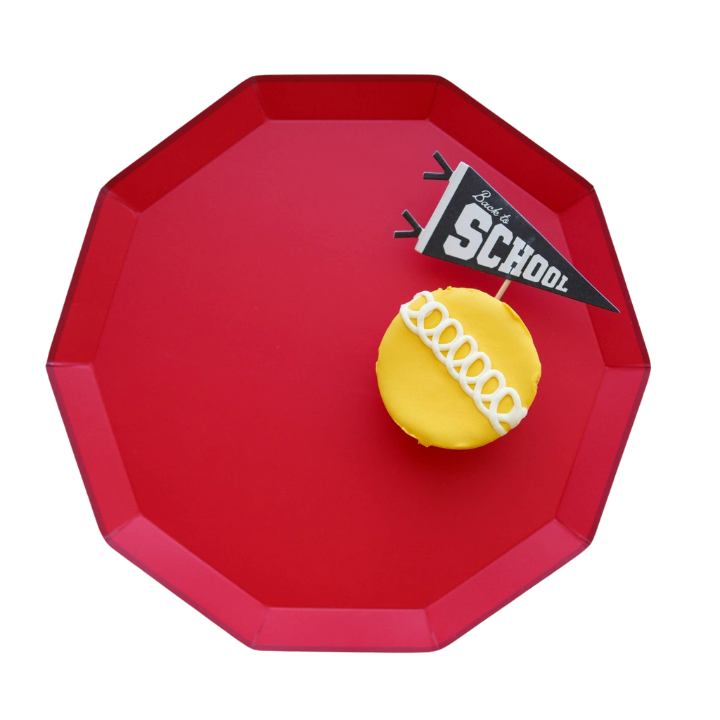 Cherry red dinner plate with a yellow cupcake and back to school sign from Parte Haus party supply store in Bethesda MD