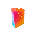 Colorful gradient gift bag with yellow handles for birthdays from Parte Haus party supply store in Bethesda Maryland