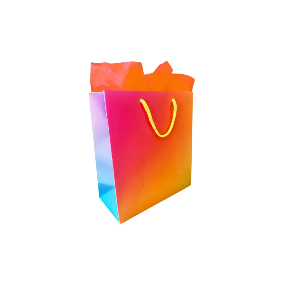 Colorful gradient gift bag with yellow handles for birthdays from Parte Haus party supply store in Bethesda Maryland