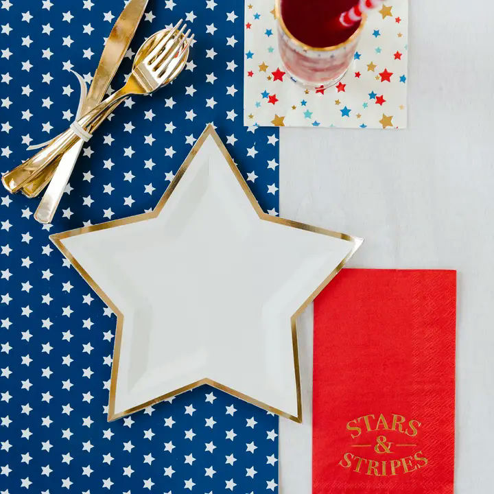 Cream star shaped dinner plate with gold trim for patriotic celebration from Parte Haus party supply store in Bethesda MD