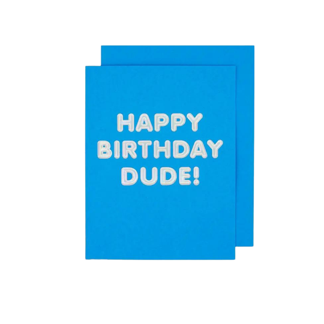 Blue birthday card with white embossed happy birthday dude lettering from Parte Haus party supply store in Bethesda Maryland