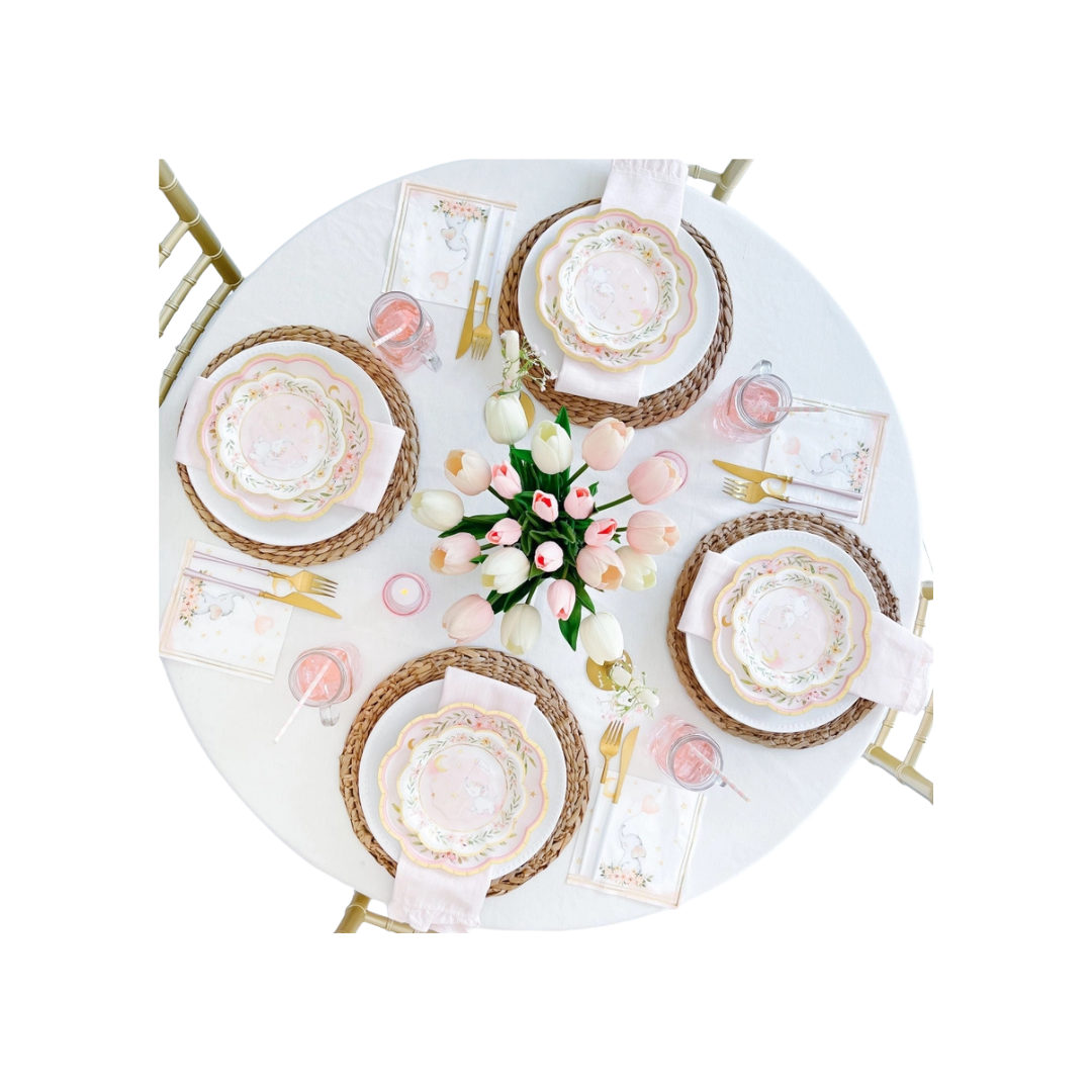 Pink elephant baby shower plates with floral accents on decorated table from Parte Haus party supply store in Bethesda MD